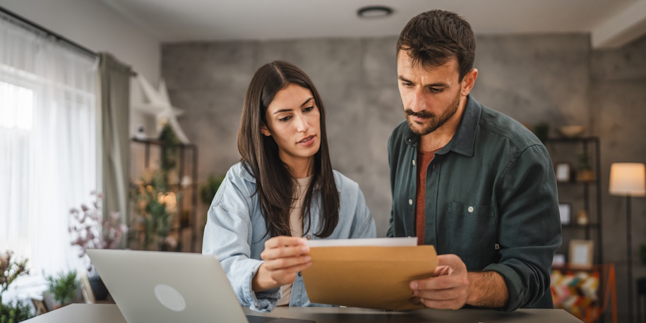 couple looking over loan paperwork
