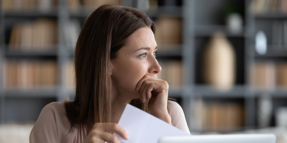 woman stressed reading letter